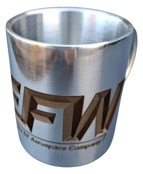 Stainless steel mug with handle and large-scale engraving of the EFW logo, an ST Aerospace Company.