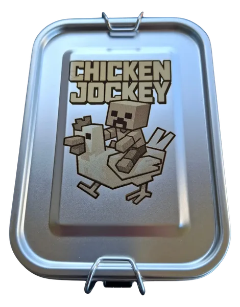 Stainless steel lunch box engraved with the Minecraft game characters Chicken Jockey and the matching lettering.